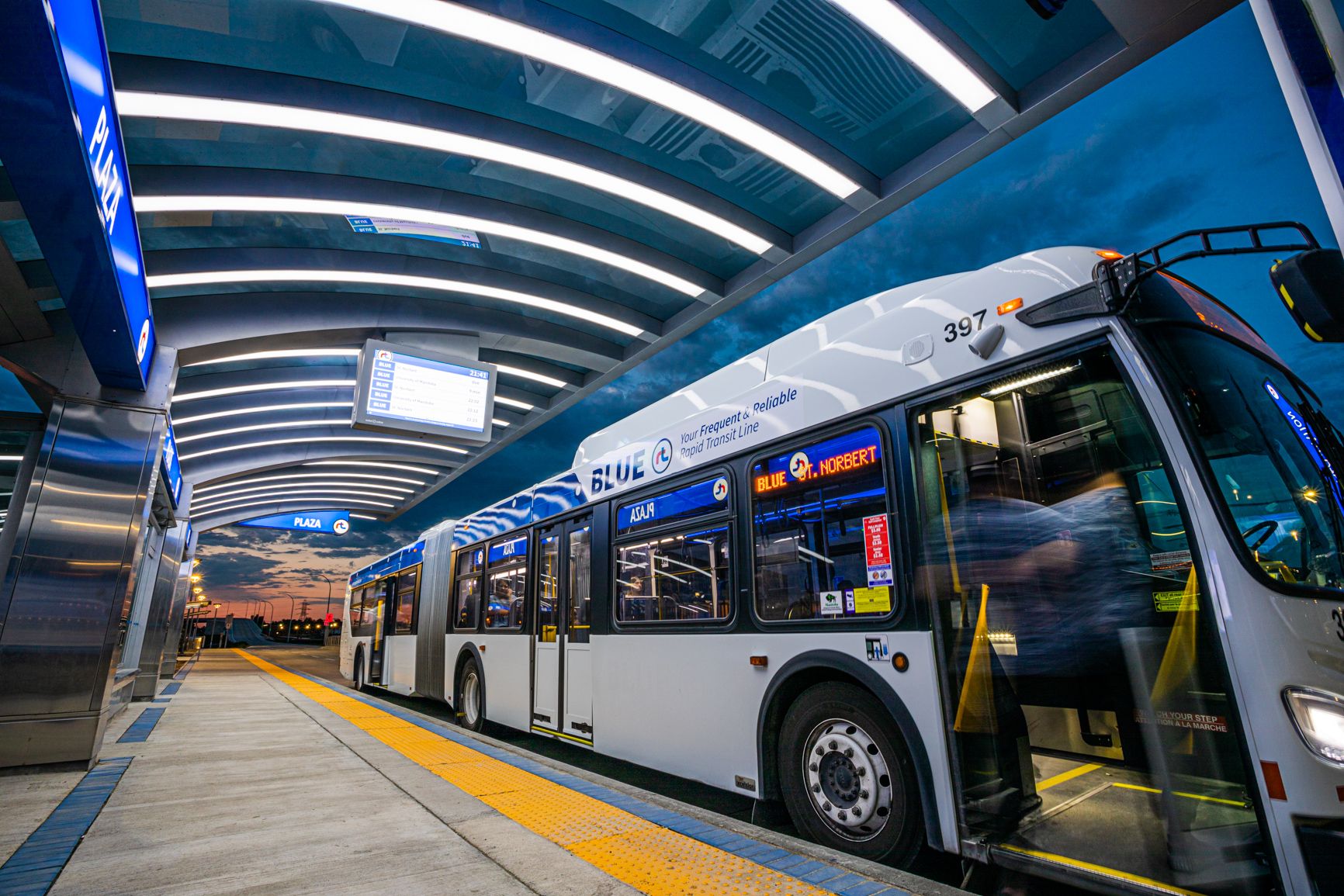 A Winnipeg Transit Blue Line articulated bus at Plaza Station