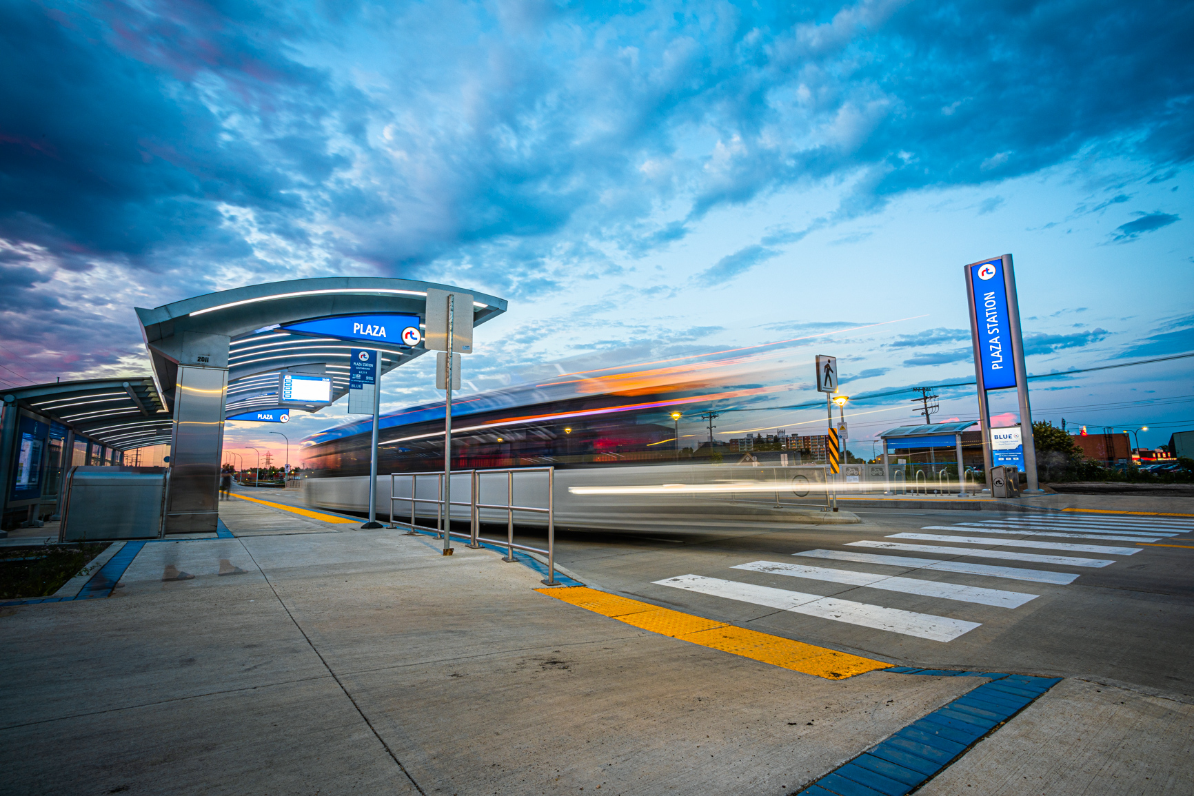 A Winnipeg Transit rapid-transit bus moving through Plaza Station